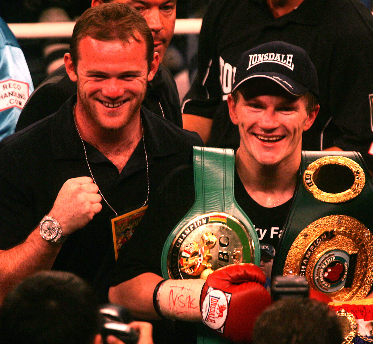 icky Hatton, Wayne Rooney and Marco Antonio Barrera celebrate in the ring after Ricky's sensational 4th round stoppage of rugged Mexican fighter Jose Luis Castillo