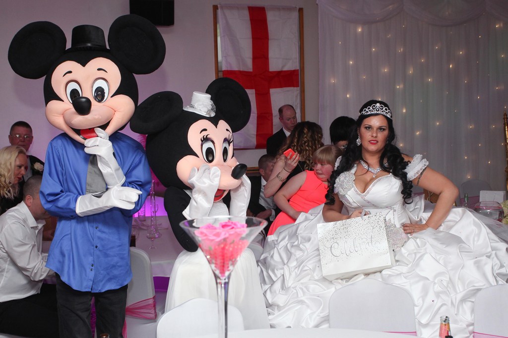 They hired actors dressed up as Mickey and Minnie Mouse to dance with the kids at the reception