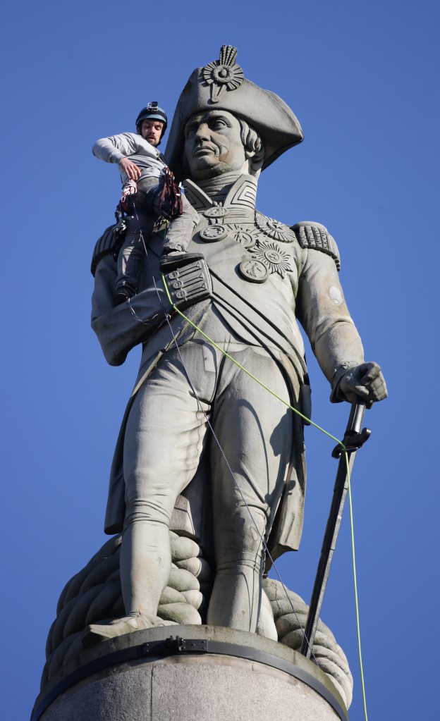 Luke Jones, 30, was arrested after clambering up Nelson's Column in Trafalgar Square this morning