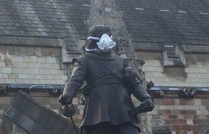 Greenpeace activists clambered up statues across the capital to protest about the capital's air quality