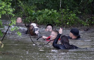 Devastating Texas floods kill five and destroy homes as month's worth of rain falls in ONE HOUR