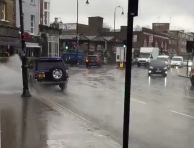 Locals in North London say the motorist has been splashing people since January and that the driver comes out 'every time it rains'