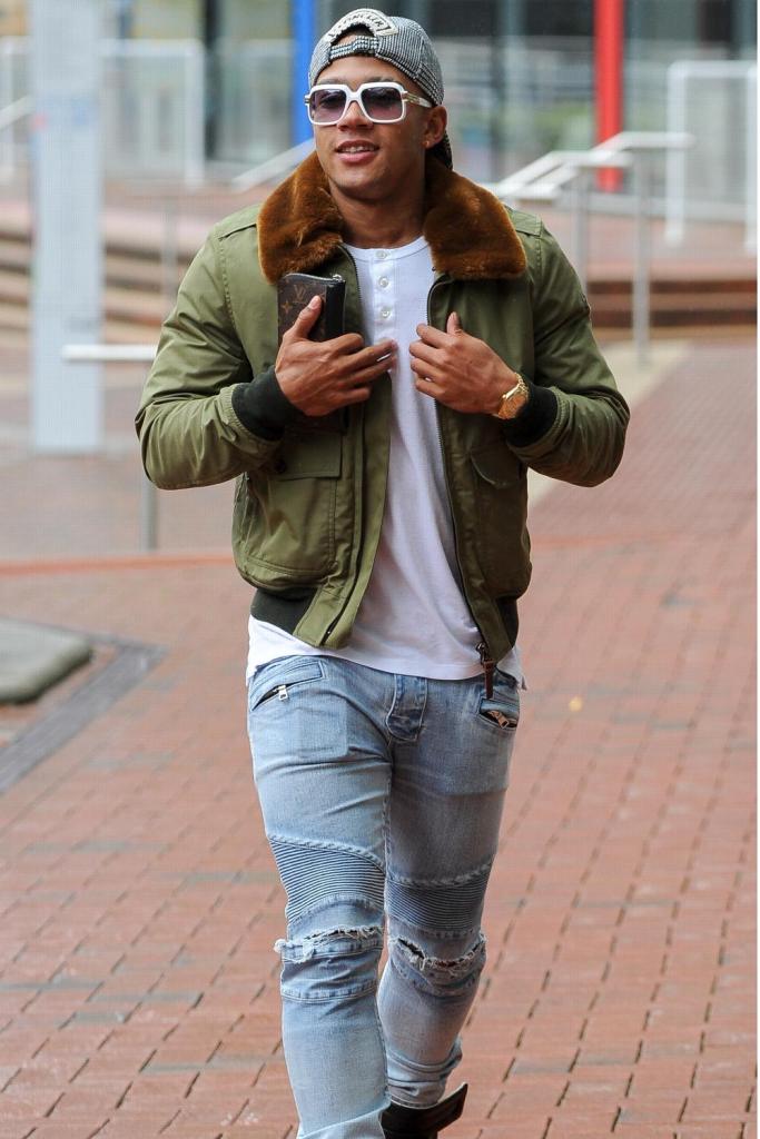 The Dutchman likes his sunglasses even in grey Manchester