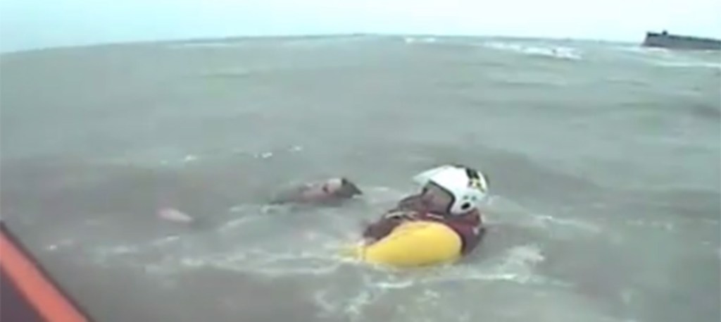 He was saved by volunteer Simon Emms who jumped into the rough seas to pull him aboard