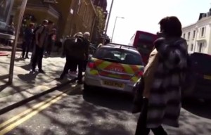 Pedestrians tried to reason with the immovable officers but didn't seem to have any luck