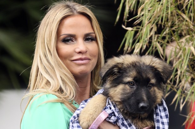 Katie Price heads home with cute pup Queenie