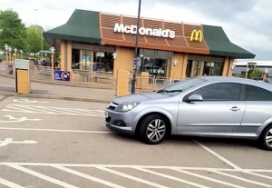 The grey Vauxhall Astra was snapped in McDonald's car park, Coventry, after it was carelessly parked across FOUR disabled bays while the selfish owners went for a meal 