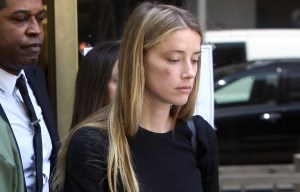Amber Heard declared a 'hero' by lawyers after surviving 'years of abuse' by 'malicious' Johnny Depp
