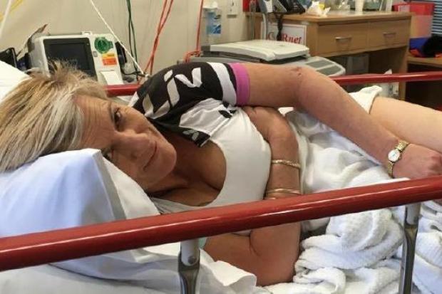 Sharon Heinrich, 45, was on the Riesling Trail in the Clare Valley with her friend when the 'cute' kangaroo jumped from an embankment and landed on her