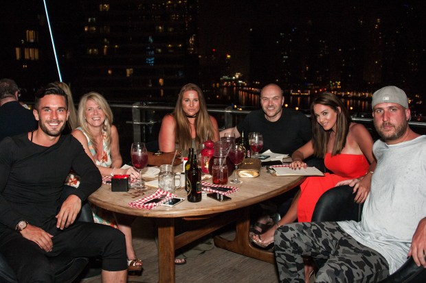 Alex sits beside Vicky's mum on a night out