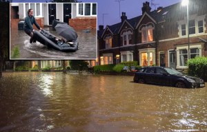 Flash flooding leaves large parts of Britain submerged after heavy rainfall - and there's no end in sight