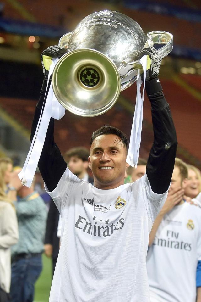 Navas hoists the Champions League trophy aloft last month 