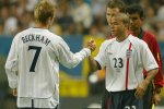 Kieron Dyer, pictured with David Beckham at the 2002 World Cup, played 33 times for England between 1999 and 2007