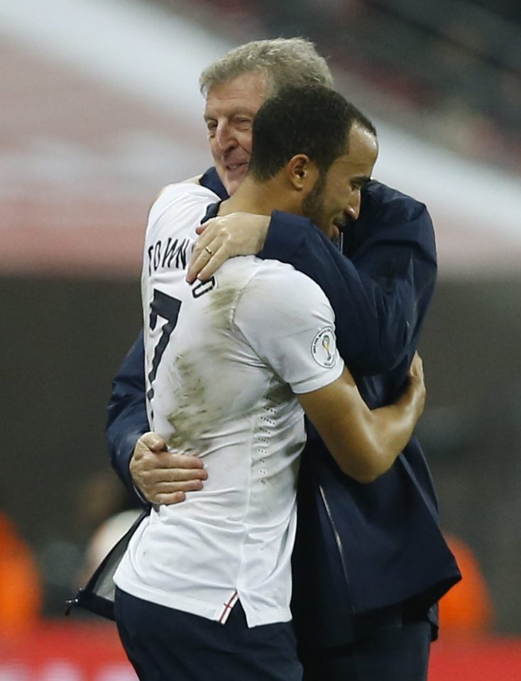 England's manager Roy Hodgson, hugs his player Andros Townsend