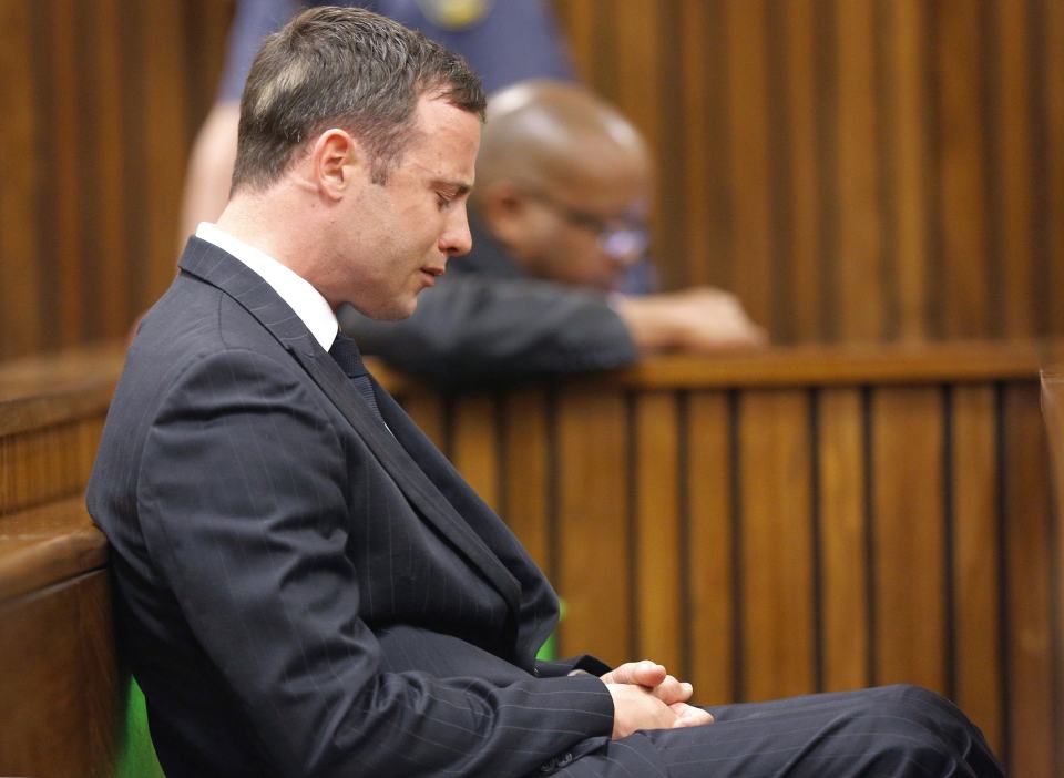 Olympic and Paralympic track star Pistorius reacts as he listens to Judge Masipa's judgement at the North Gauteng High Court in Pretoria