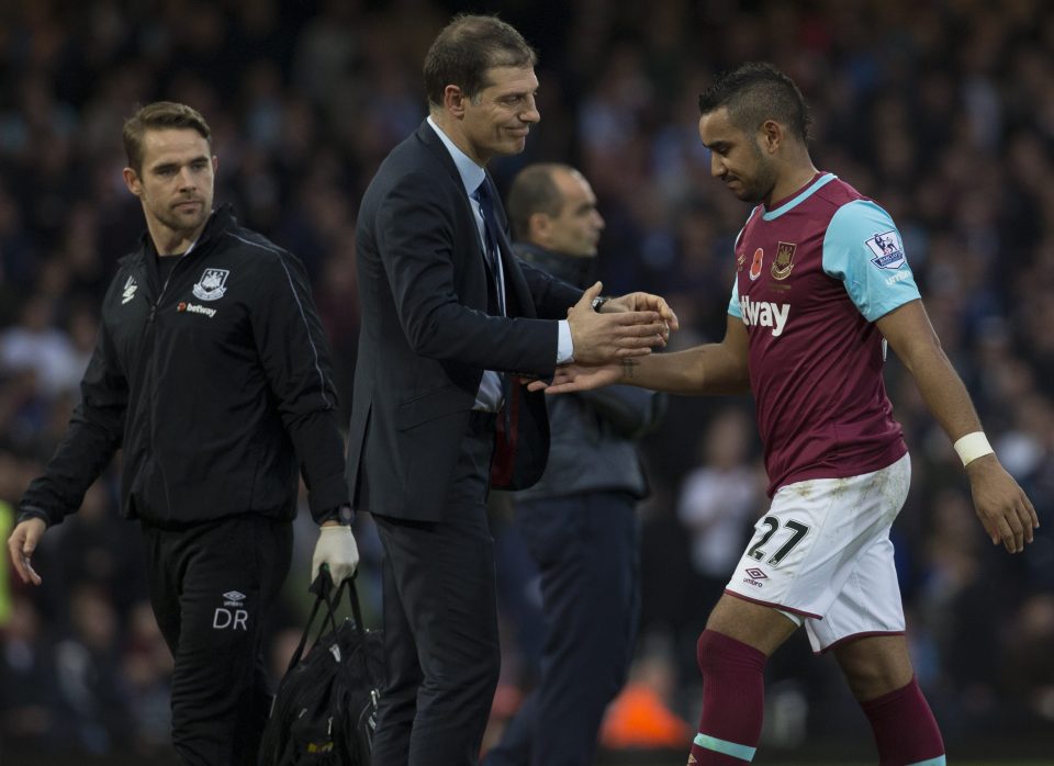 Dimitri Payet gets injured and is consoled after being subbed by manager Slaven Bilic