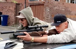 Picture shows Geordie Shore star posing with a gun in a public street