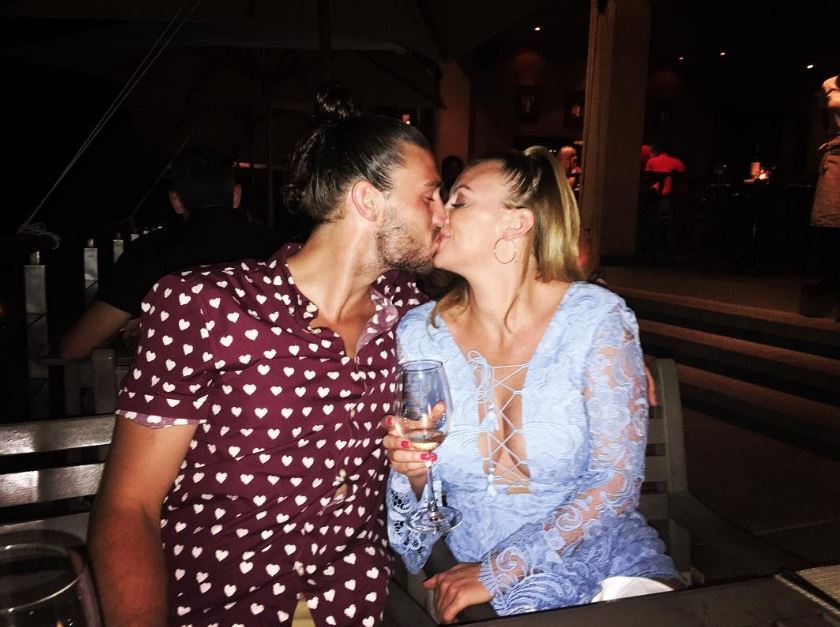 West Ham striker Andy Carroll is on holiday with his fiancee Billi Mucklow and their son Arlo