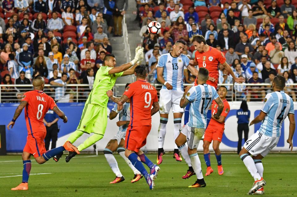 Sergio Romero flaps at a cross as Jose Fuenzalida nets Chile's consolation goal
