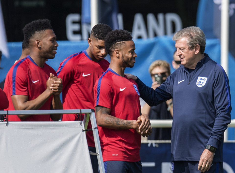 Roy Hodgson has words with Manchester City star, Raheem Sterling, during training