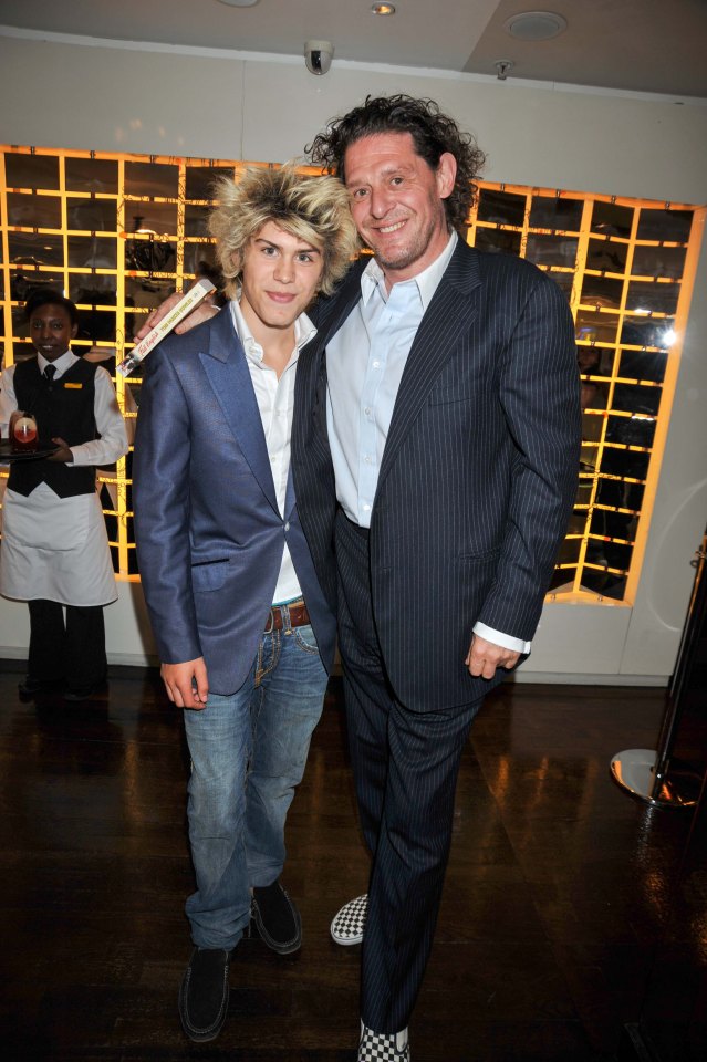 Marco Jr as a child with his father