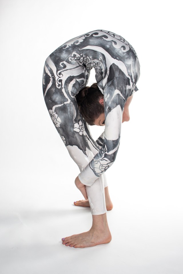 Claudia bends over backwards in a move called the Despina