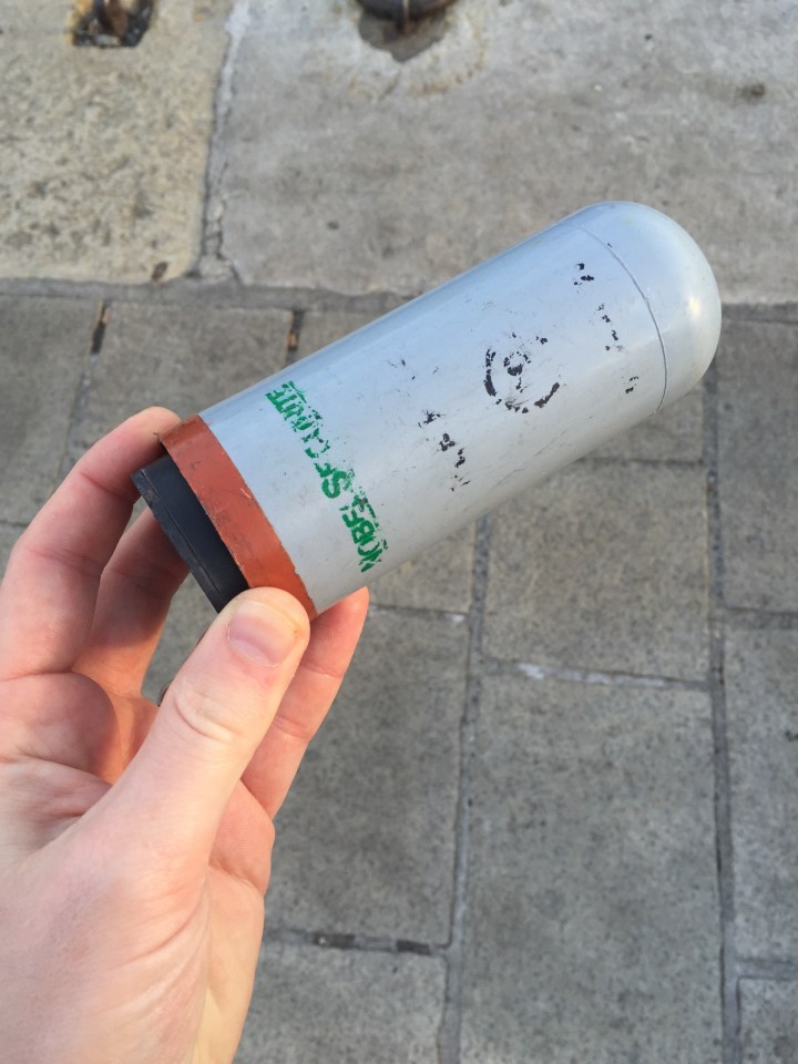 The clean-up operation on Friday morning saw some of the gas canisters used against British fans found lying in the street