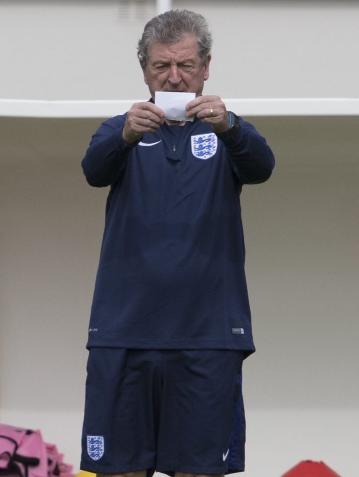 The England boss has a quick check at his notes on the scrap of paper