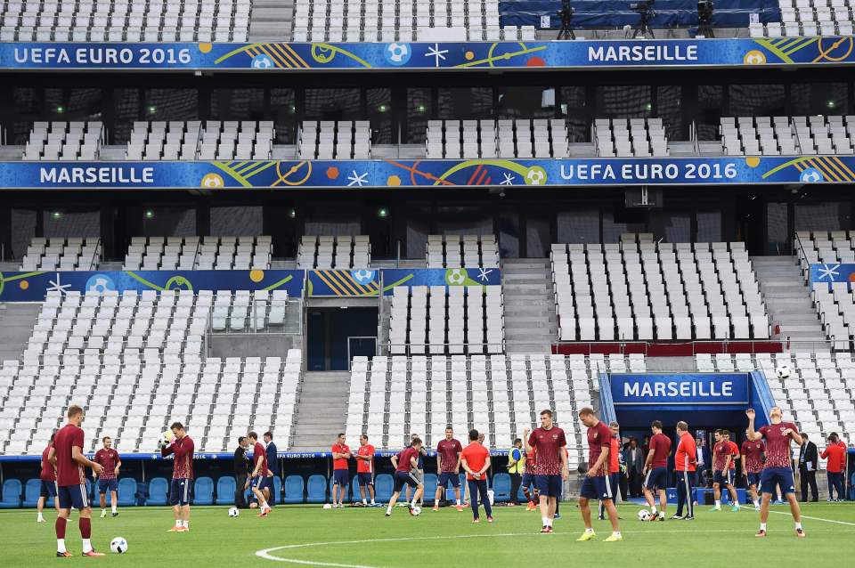 Russian players warm up ahead of their first game against England