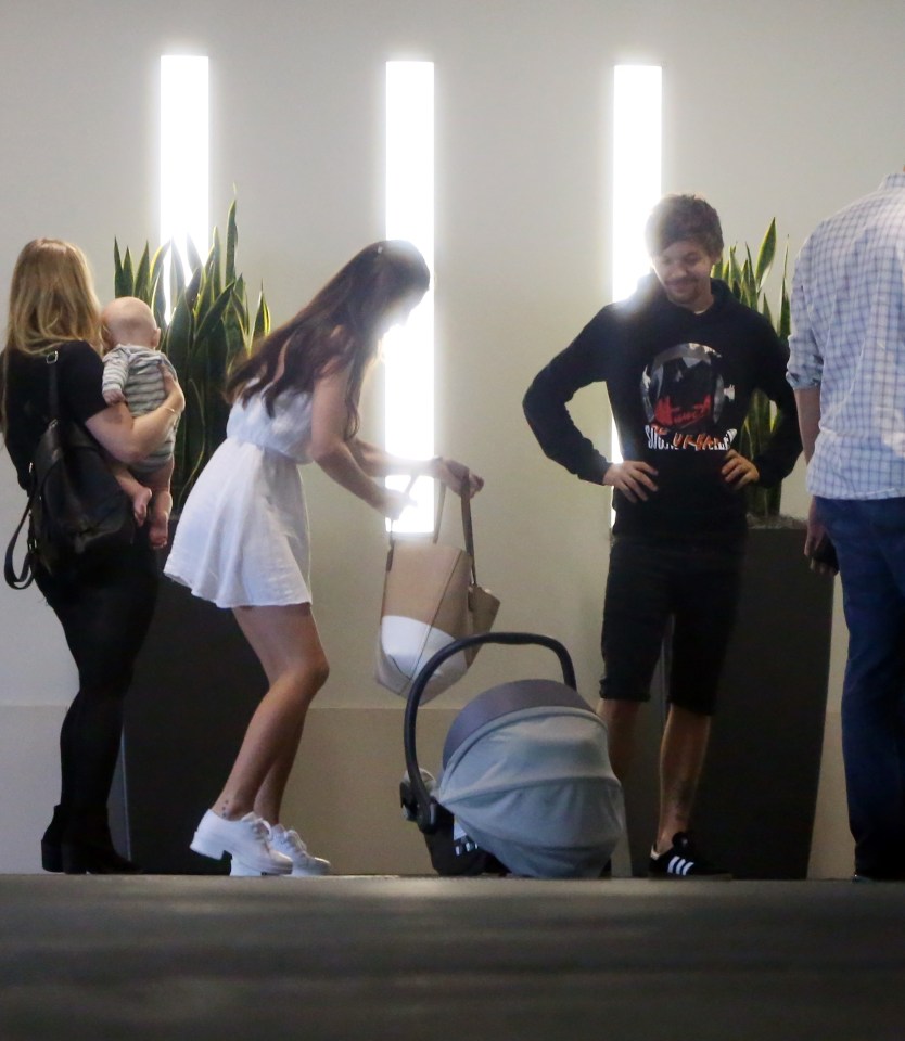 Louis watches as Briana lifts Freddie's carrier 
