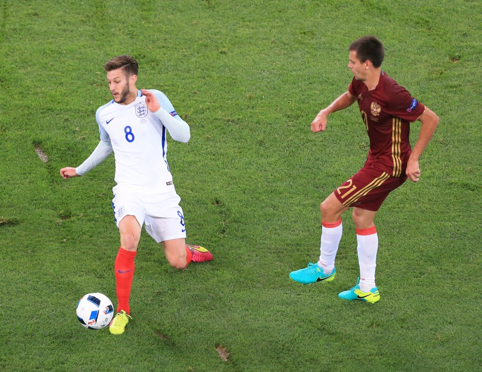 Adam lallana of England and Georgi Schennikov of Russia during the UEFA European Championship 2016 match at the Stade Velodrome, Marseille. 