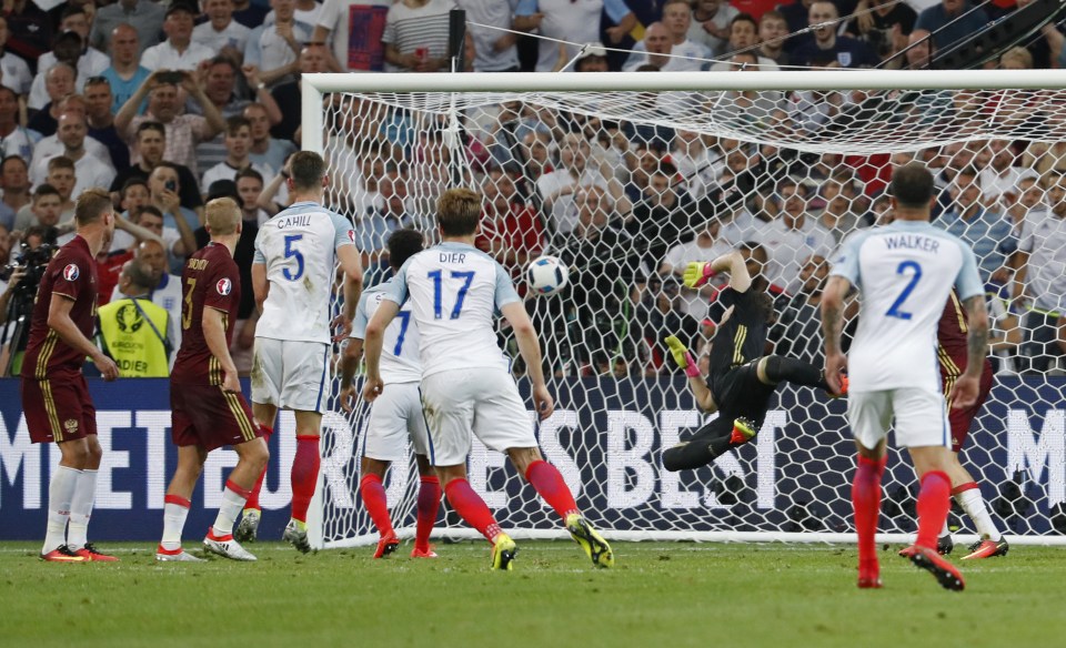 Eric Dier watches his free-kick nestle in the back of the net against Russia