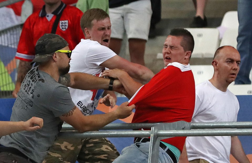 An England fan us punched as Russia supporters stormed their section in the Stade Velodrome