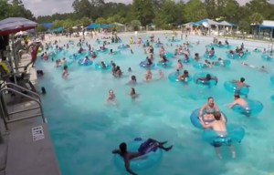 Can you spot the drowning three-year-old in packed pool as lifeguard dives in to save her?