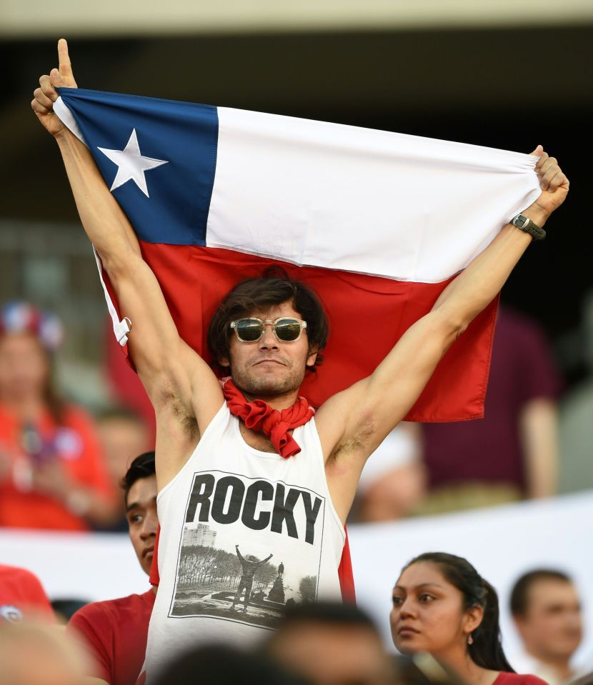 A Chile fan in Rocky t shirt cheers his national side on in Philadelphia 