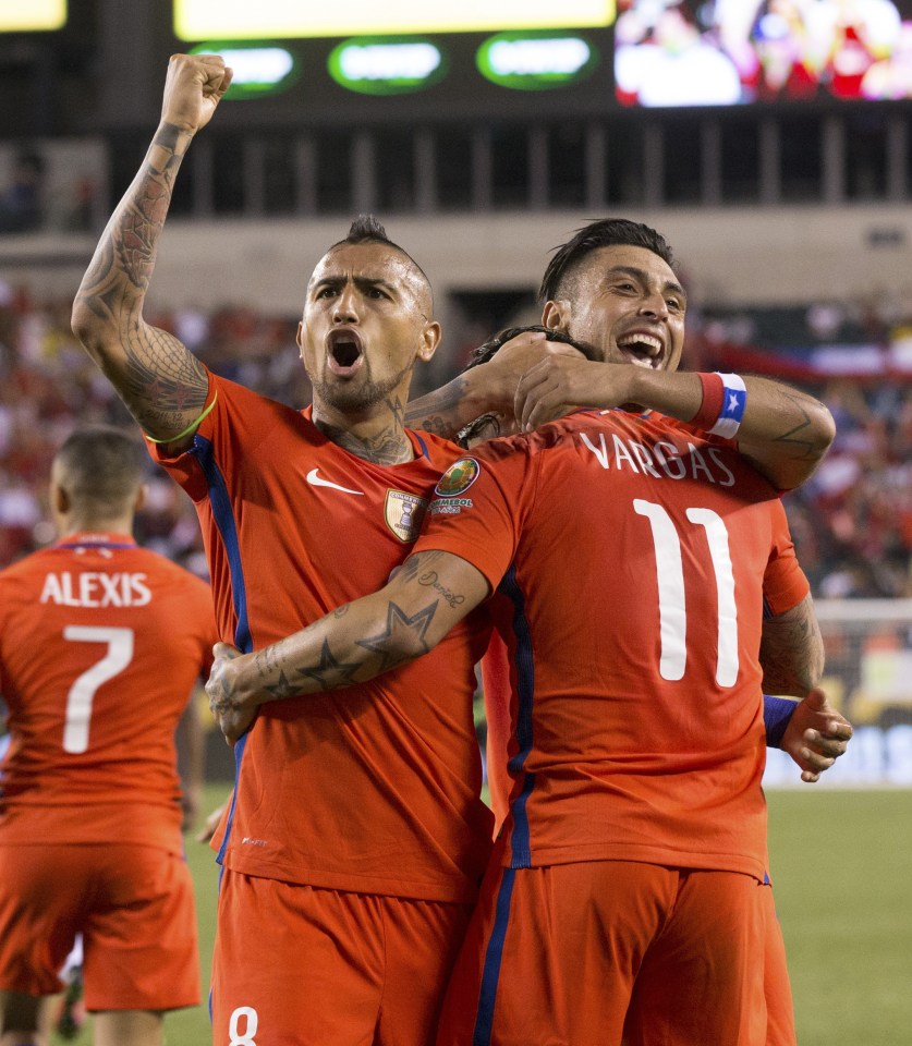 Arturo Vidal celebrates with Eduardo Vargas as Chile take a 2-1 lead against Panama