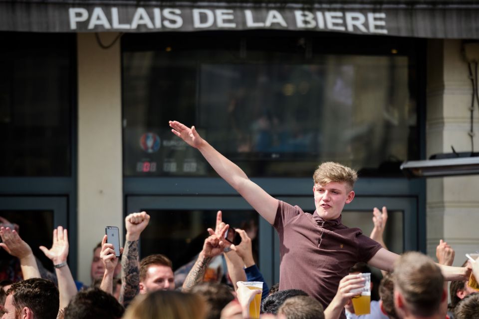 England fans drink at a bar in central L