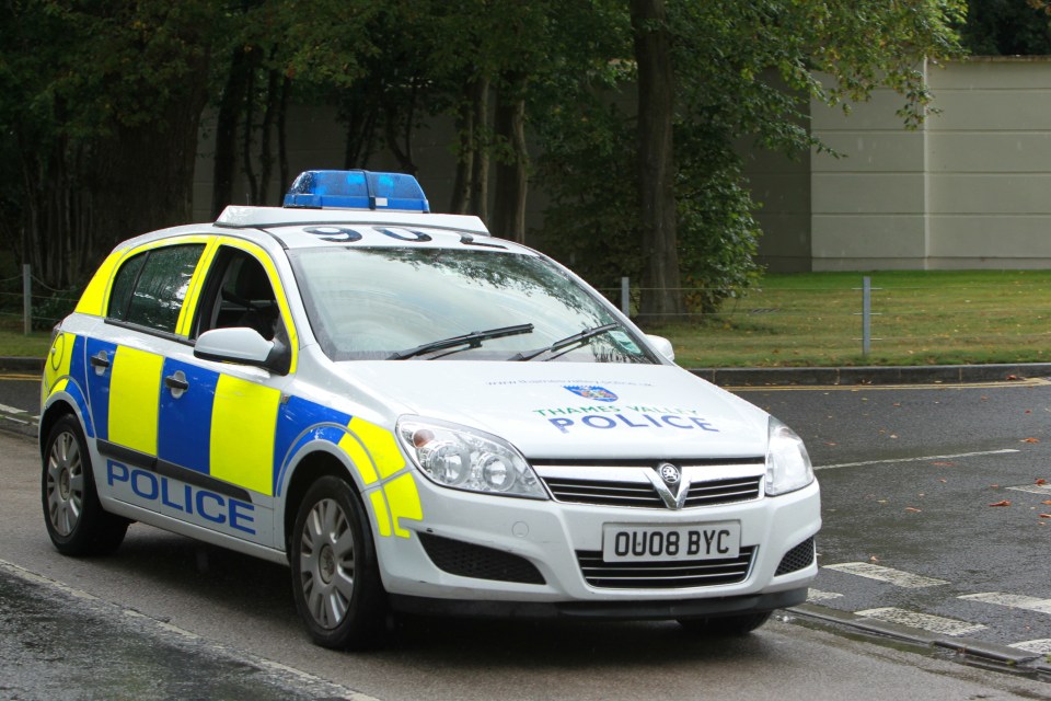 Police pictured outside Sir Cliff's £3million home during the two-year investigation which cost around £800,000
