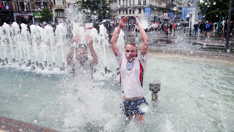 Football fans were unfazed by the cooler weather in France, even frolicking in a fountain in Lille before the match
