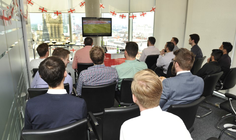 Manchester office watch footie