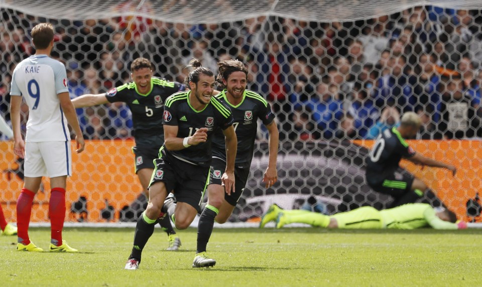 Gareth Bale turns away in celebration after opening the scoring against England