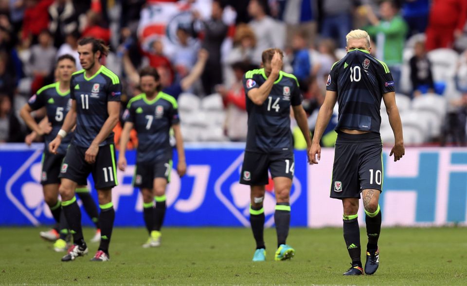 The Wales players trudge off after Daniel Sturridge struck late to deny them a draw