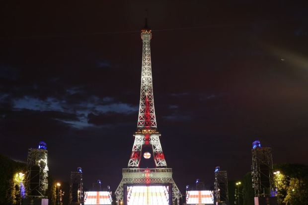 The Eiffel Tower lit up in the colours of a St George's cross