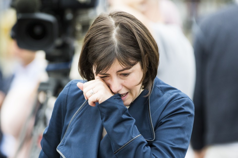 MP Lucy Powell breaks down in tears at the scene in Birstall market place this morning where MP Jo Cox was murdered yesterday
