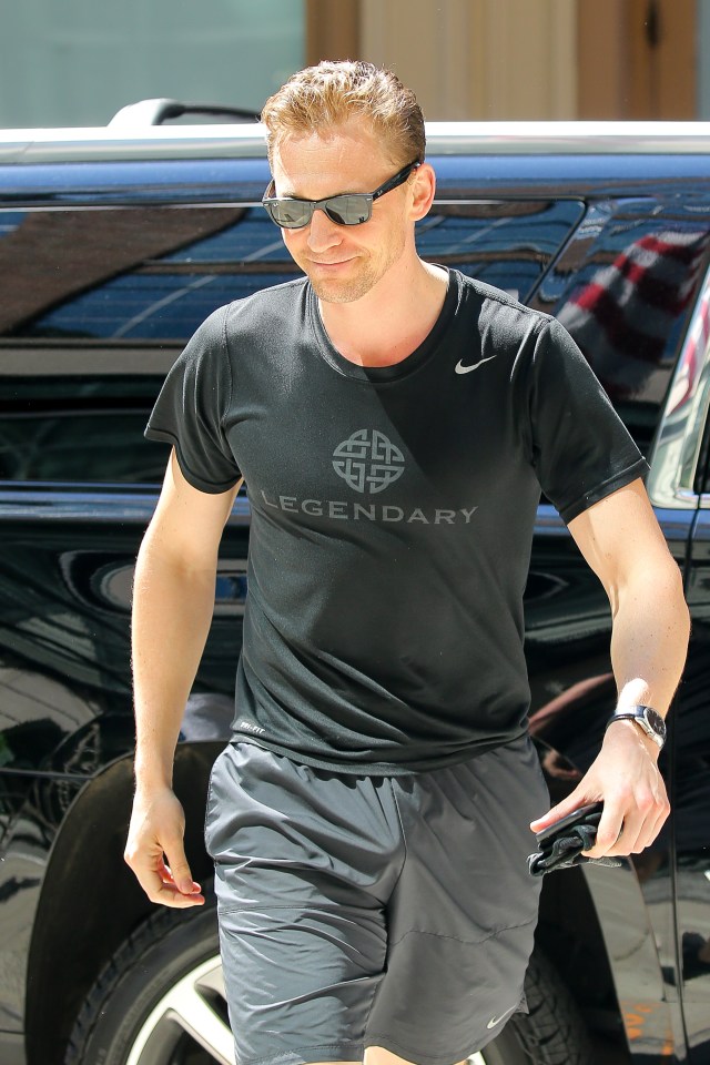 Tom's smirk was clear to see as he was snapped back in New York