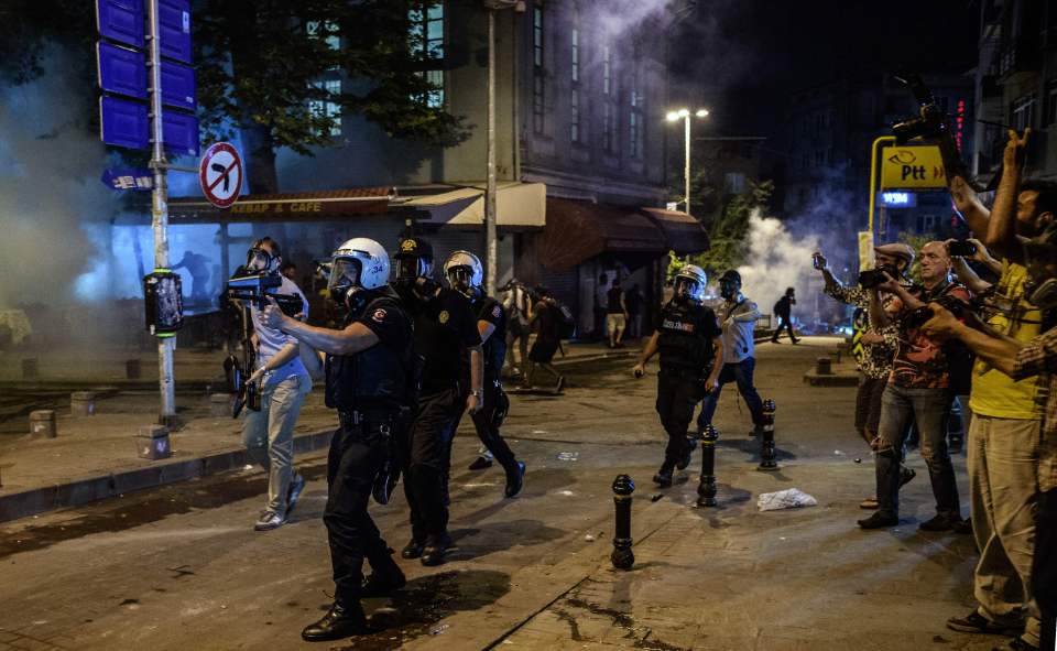 Turkish anti riot police officers fire r