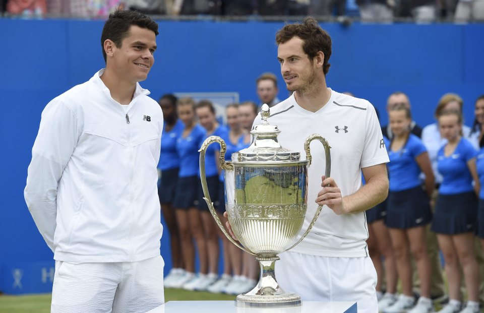Andy Murray celebrates with the Queen's title after beating Milos Raonic