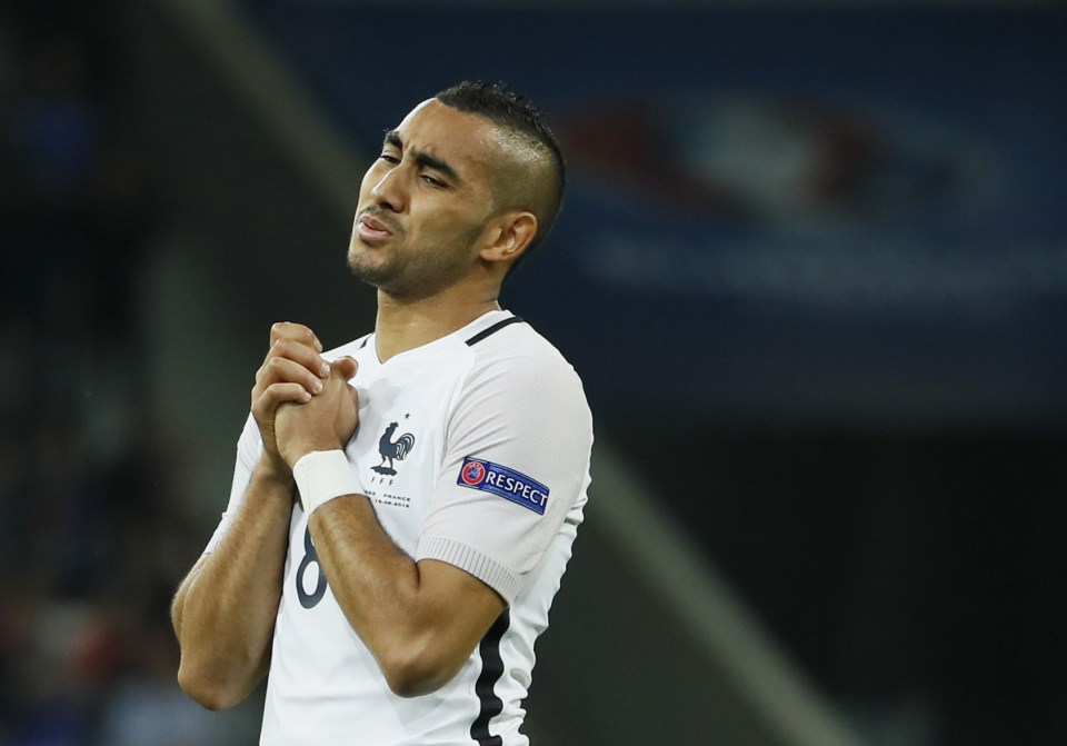 Dimitri Payet reacts in frustration after his volley hits the bar
