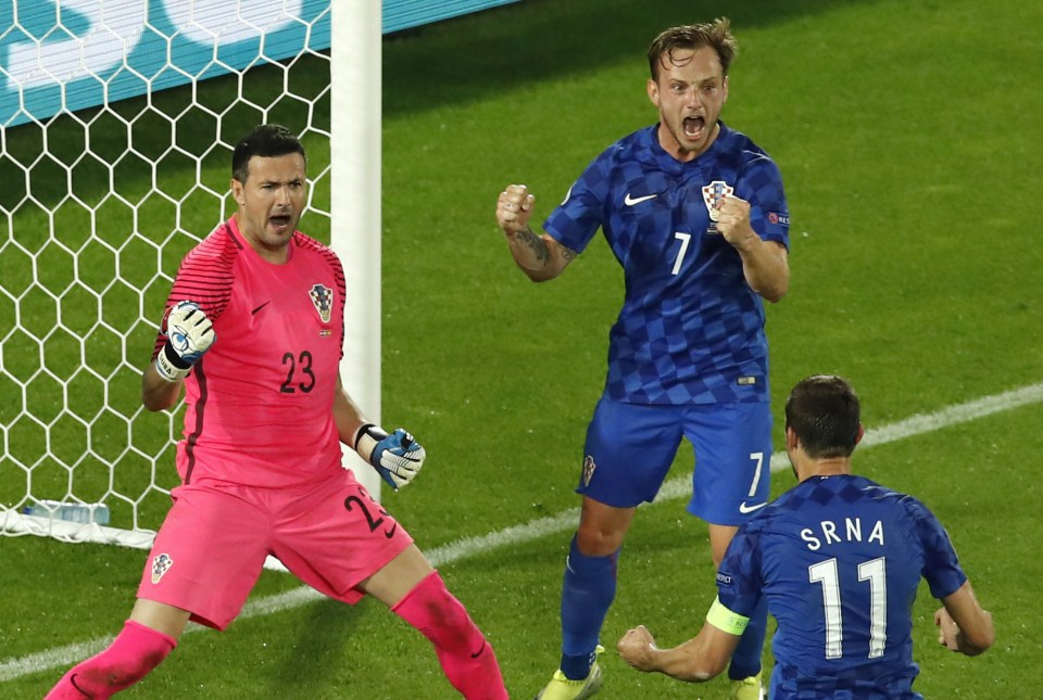 Danijel Subasic celebrates with Darijo Srna as Luka Modric's tip pays off