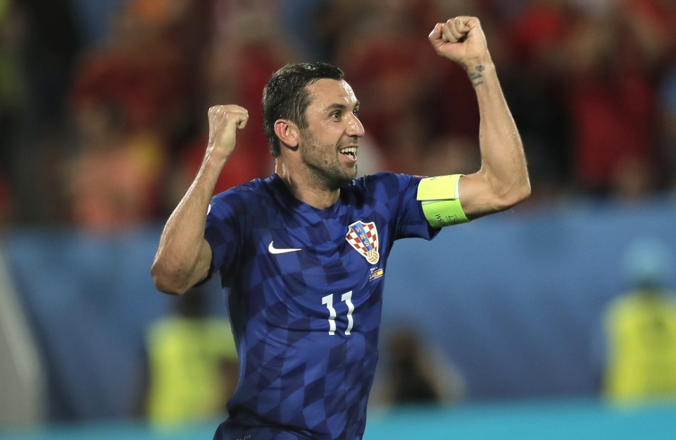 Darijo Srna looks over to the bench as he celebrates the saved penalty kick
